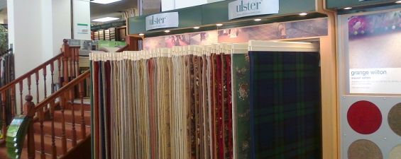 Wall-mounted carpet displays